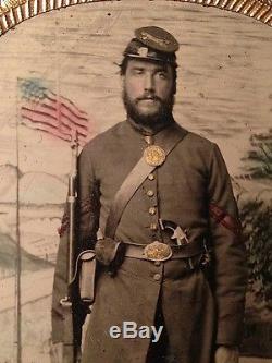 1860s CIVIL WAR Tinted TINTYPE of ARTILLERY Corporal w PISTOL Musket FLAG Camp