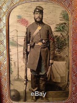 1860s CIVIL WAR Tinted TINTYPE of ARTILLERY Corporal w PISTOL Musket FLAG Camp