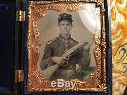 Authentic Civil War tin type of a Union Soldier holding three weapons