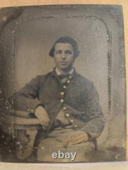 Civil War tintype of an Unidentified seated Union soldier in a half case