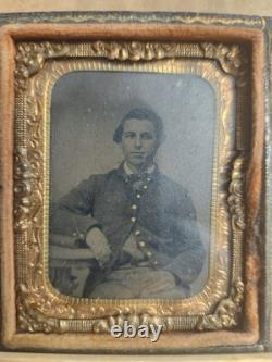 Civil War tintype of an Unidentified seated Union soldier in a half case