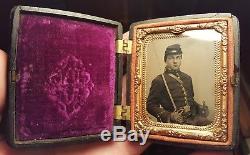 Civil War tintype of cavalry soldier armed with sword- union case