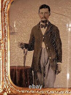 Civil War tintype of soldier with great shot of Remington revolver tinted table