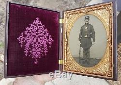 Half plate civil war tintype of armed soldier with great union case exceptional