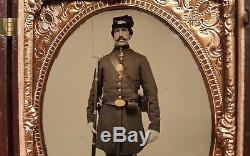 Half plate civil war tintype of armed soldier with great union case exceptional