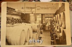 Post Civil War cabinet card of a liquor store, lots of barrels, sharp image