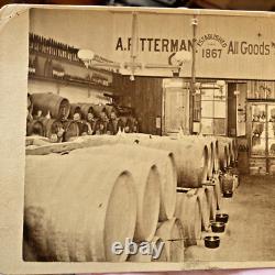 Post Civil War cabinet card of a liquor store, lots of barrels, sharp image