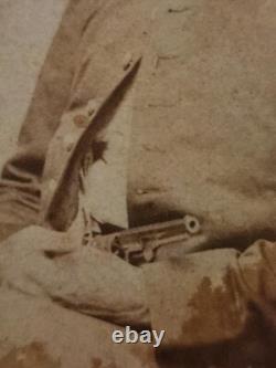 REVOLVER! Unidentified CDV of a seated Civil War Soldier with a revolver